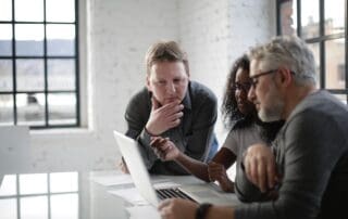 People looking at a computer studying.
