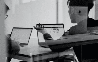 Two people on a computer starting a business