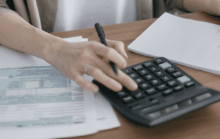 Person working a calculator